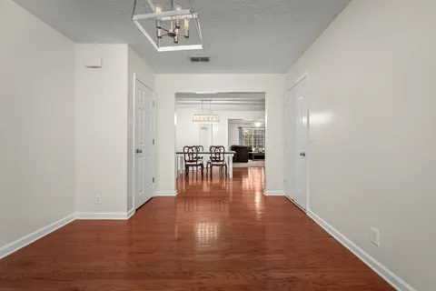 a view of dining room with wooden floor