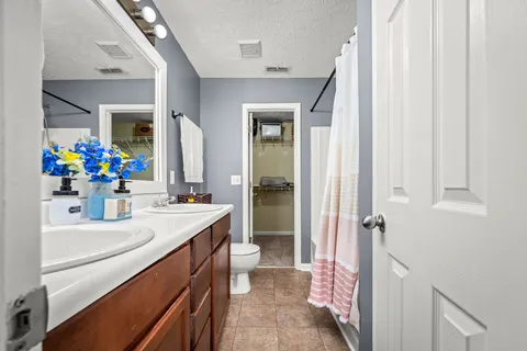 a bathroom with a sink a vanity and a mirror