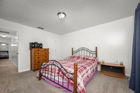a bedroom with a bed and a cabinets