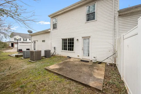 a view of a house with a yard and garage