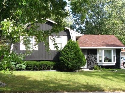 1007 Purdue Lane Matteson, IL 60443 - Photo 1 of 1 a front view of a house with a garden and plants