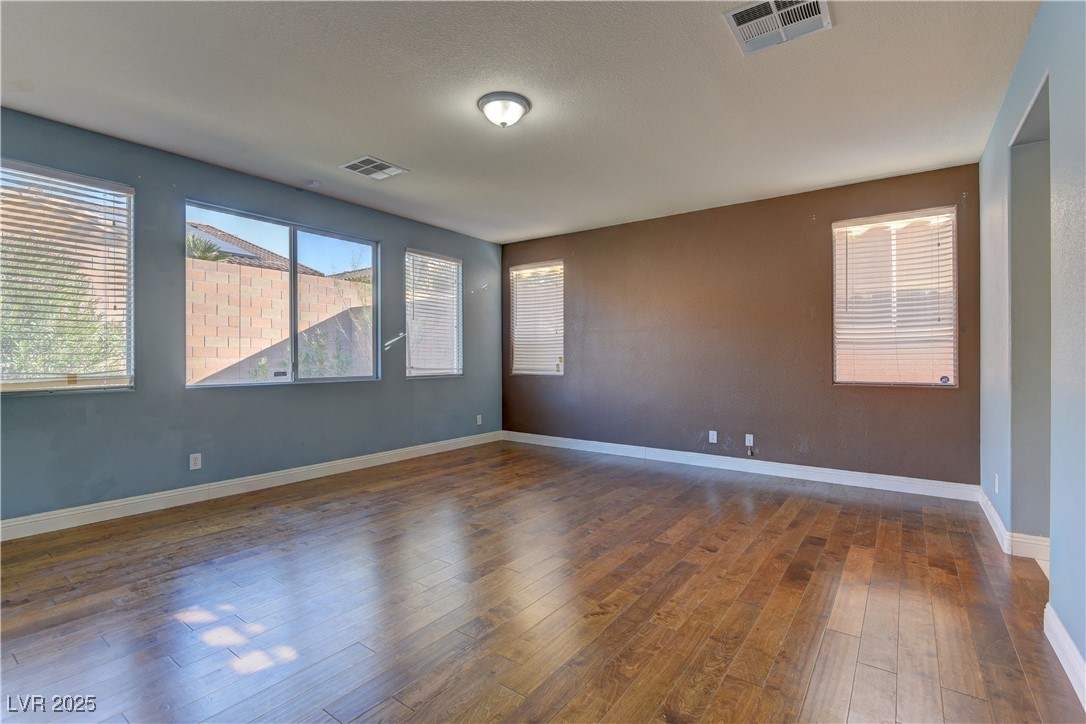 972 Rue Grand Paradis Lane Henderson, NV 89011 - Photo 14 of 32 Unfurnished room with dark wood-style floors and baseboards