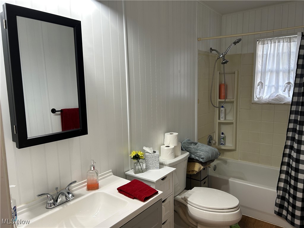 61634 Institute Road Lore City, OH 43755 - Photo 14 of 20 Full bathroom with vanity and shower / bathtub combination with curtain