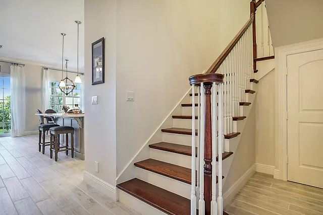 a view of a hallway with furniture and entryway
