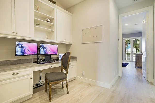 a dining room with furniture and a flat screen tv