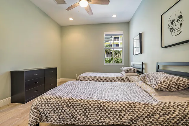 a bedroom with a bed and a dresser