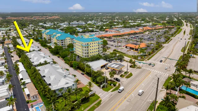 an aerial view of residential houses with outdoor space