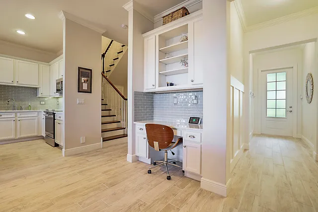 a view of kitchen with furniture and wooden floor
