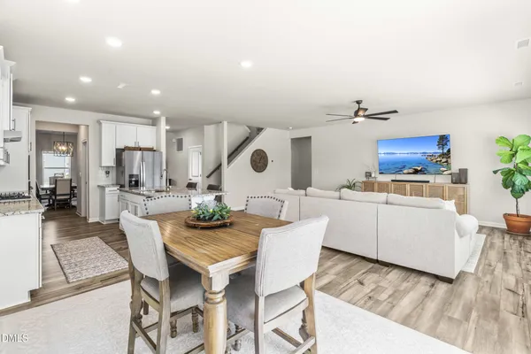a view of kitchen with cabinets and wooden floor