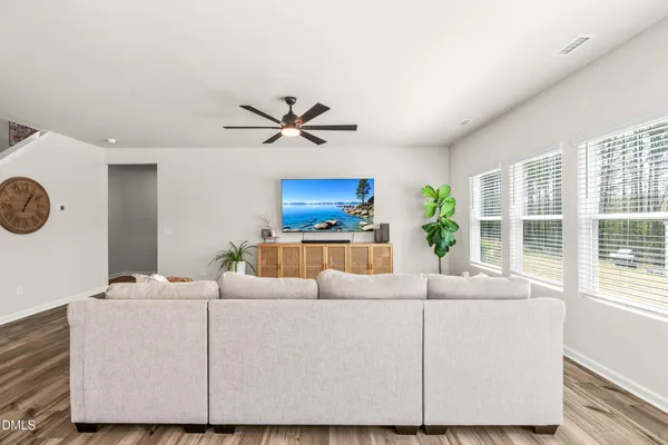 a living room with furniture and a large window