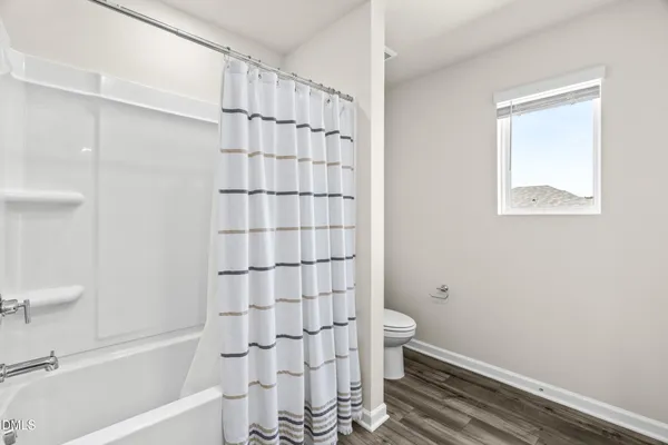 a bathroom with a bathtub and shower