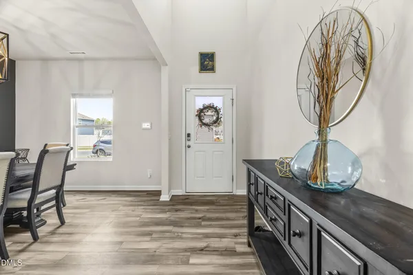 a view of a livingroom with furniture and wooden floor