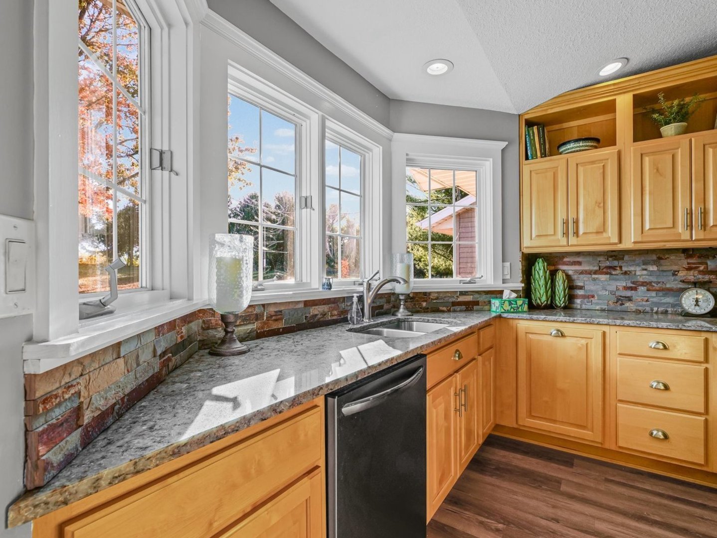 13 Prairie Acres Monticello, IL 61856 - Photo 18 of 53 a large kitchen with granite countertop a sink large window white cabinets and stainless steel appliances