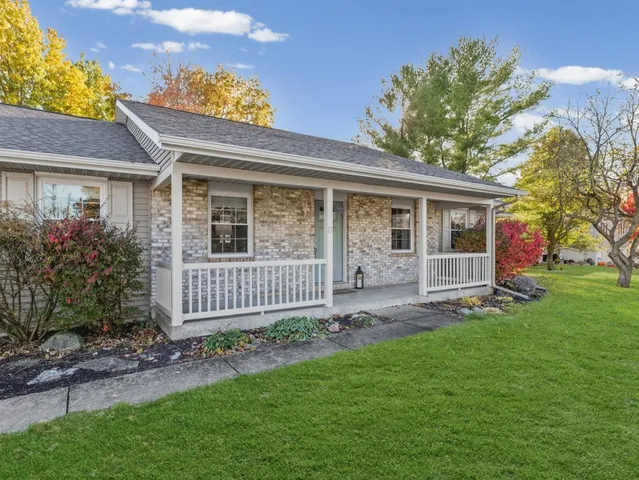 front view of a house with a yard
