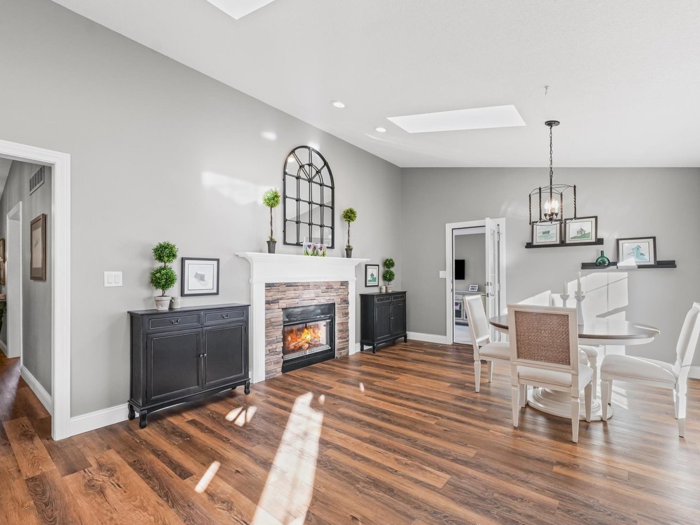13 Prairie Acres Monticello, IL 61856 - Photo 22 of 53 a living room with furniture a fireplace and a chandelier