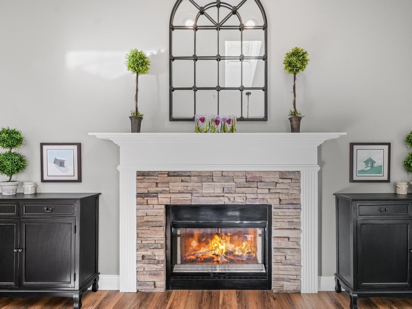 13 Prairie Acres Monticello, IL 61856 - Photo 23 of 53 a living room with a fireplace and a potted plant