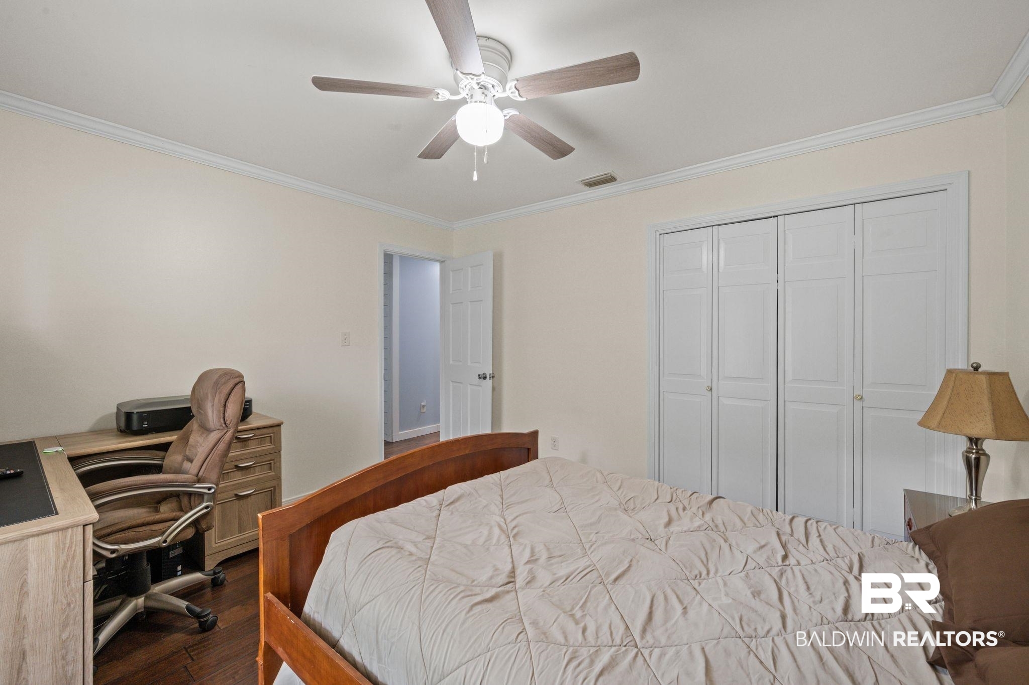 20037 County Road 33 Fairhope, AL 36532 - Photo 27 of 79 Bedroom featuring a closet, ceiling fan, ornamental molding, and dark hardwood / wood-style flooring