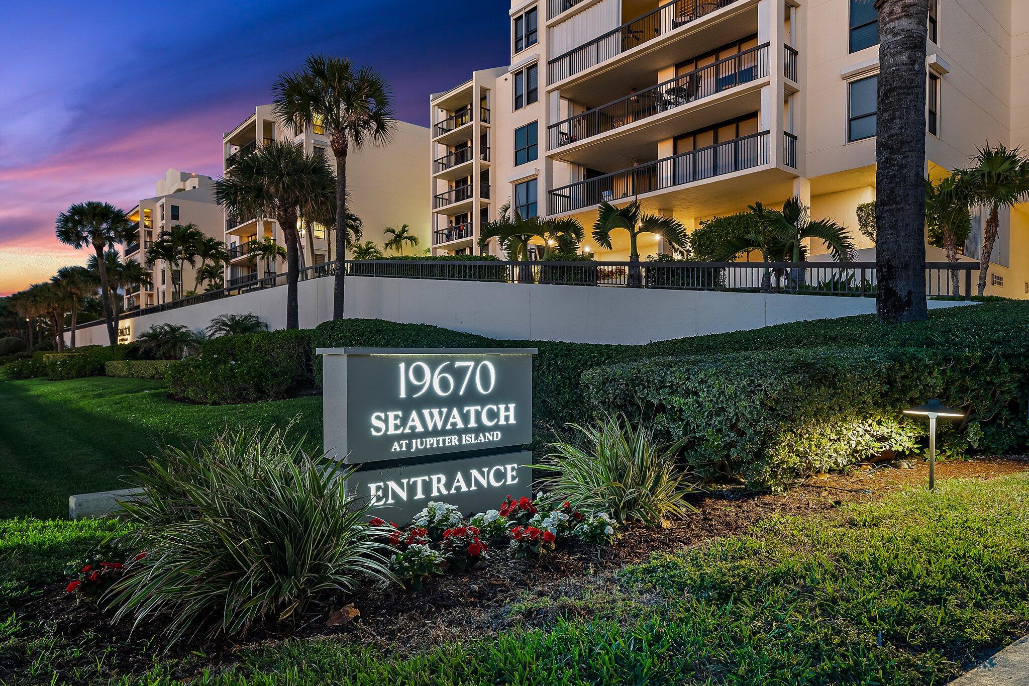 19670 South Beach Road, Unit B303 Jupiter, FL 33469 - Photo 92 of 104 a view of sign board with tall buildings and trees in the background
