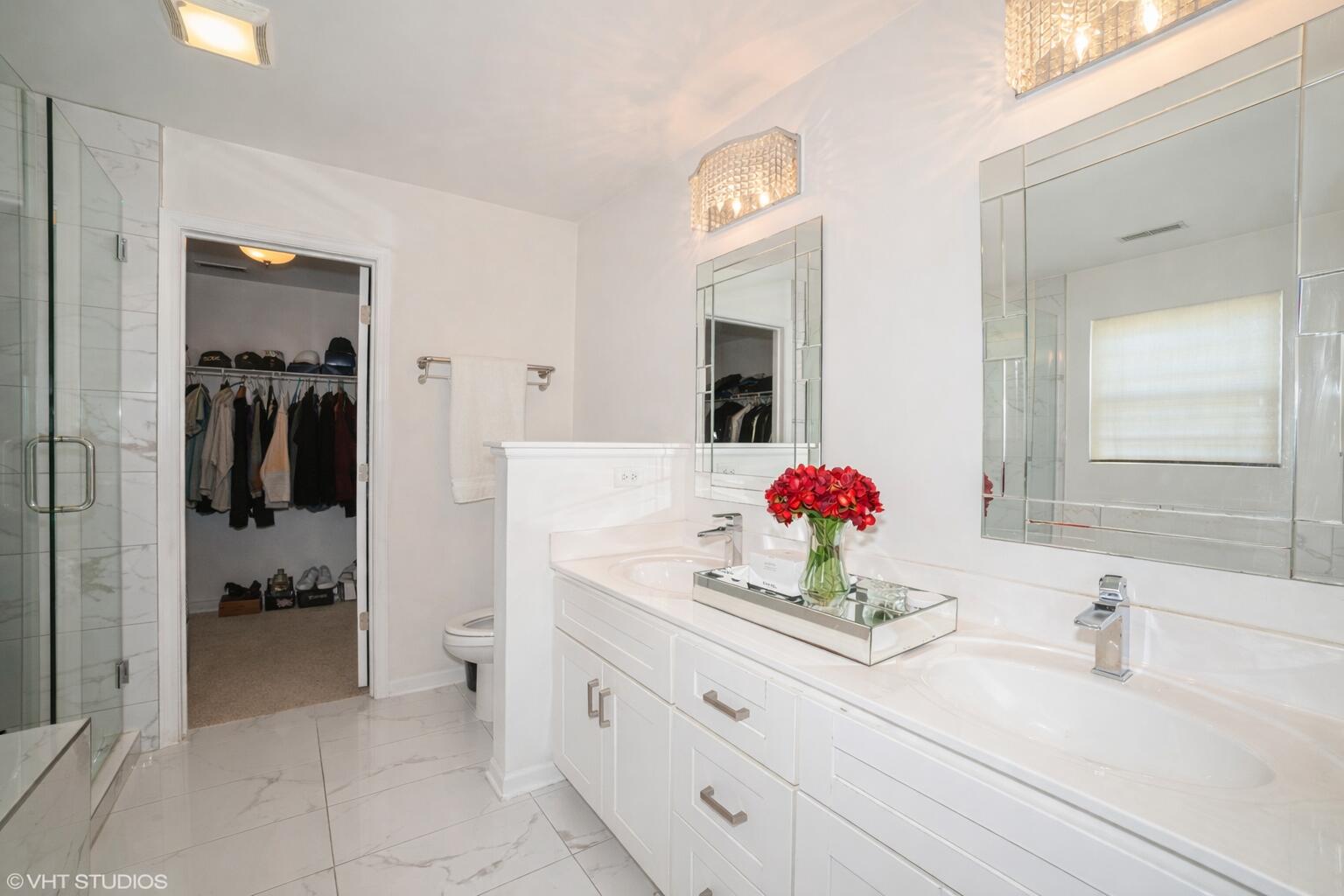 8569 Marshall Street Merrillville, IN 46410 - Photo 7 of 10 a bathroom with a sink vanity and mirror