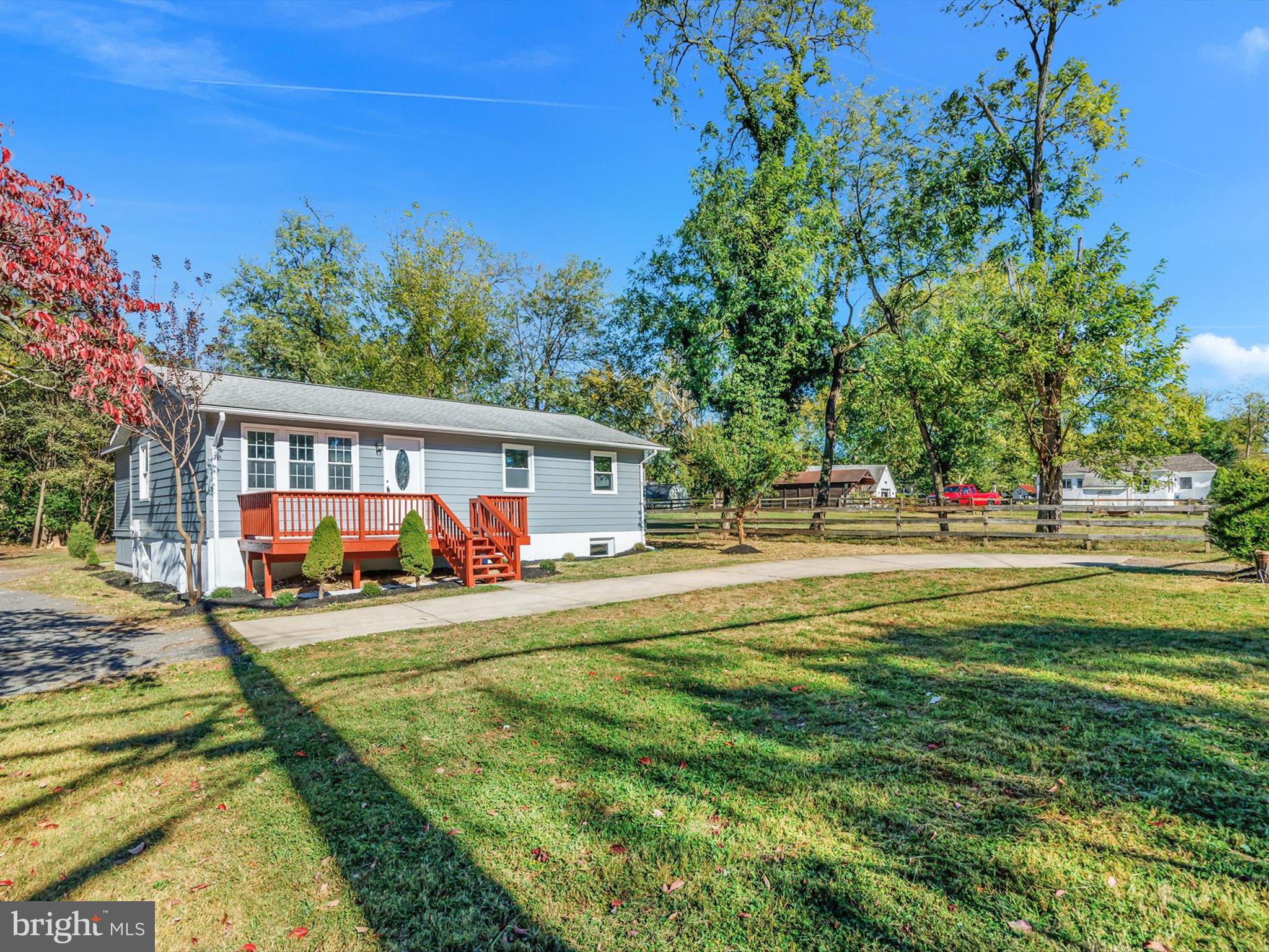 a view of a house with swimming pool and sitting area
