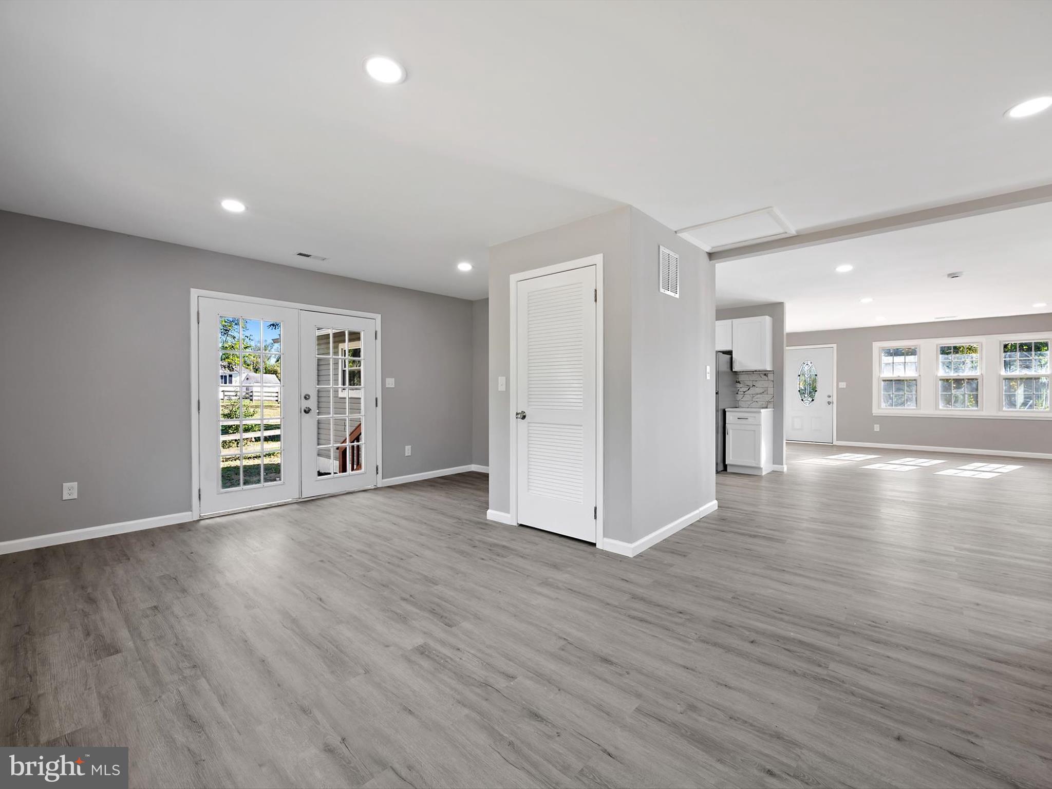 8635 Emory Grove Road Gaithersburg, MD 20877 - Photo 12 of 38 a view of an empty room with wooden floor
