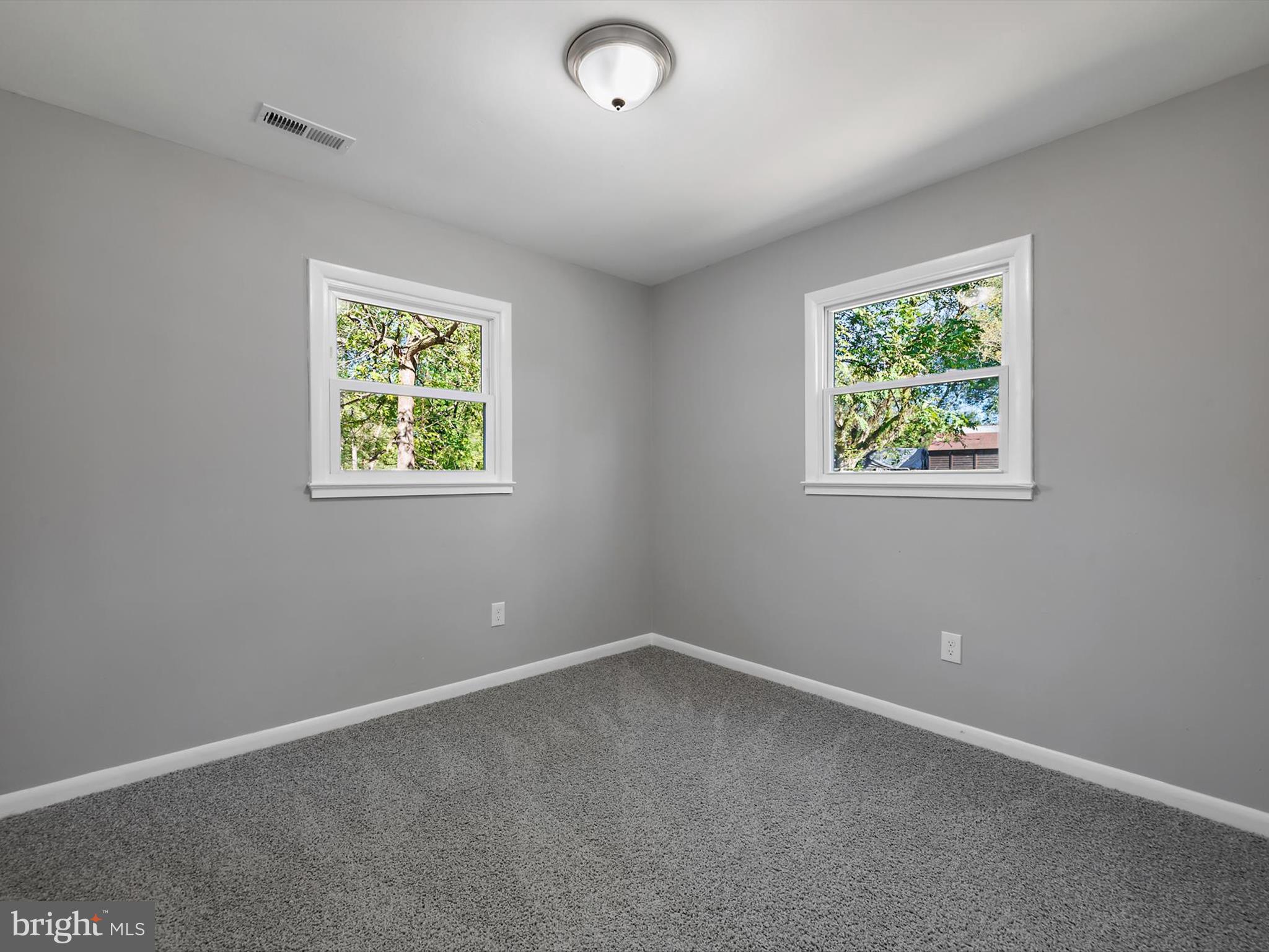 8635 Emory Grove Road Gaithersburg, MD 20877 - Photo 18 of 38 an empty room with windows
