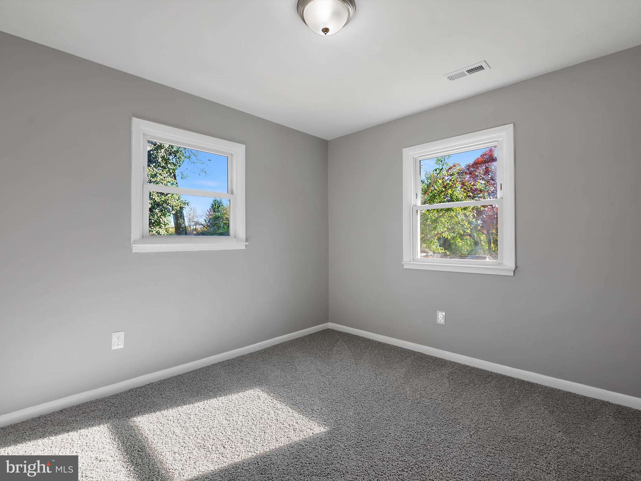 8635 Emory Grove Road Gaithersburg, MD 20877 - Photo 20 of 38 an empty room with windows