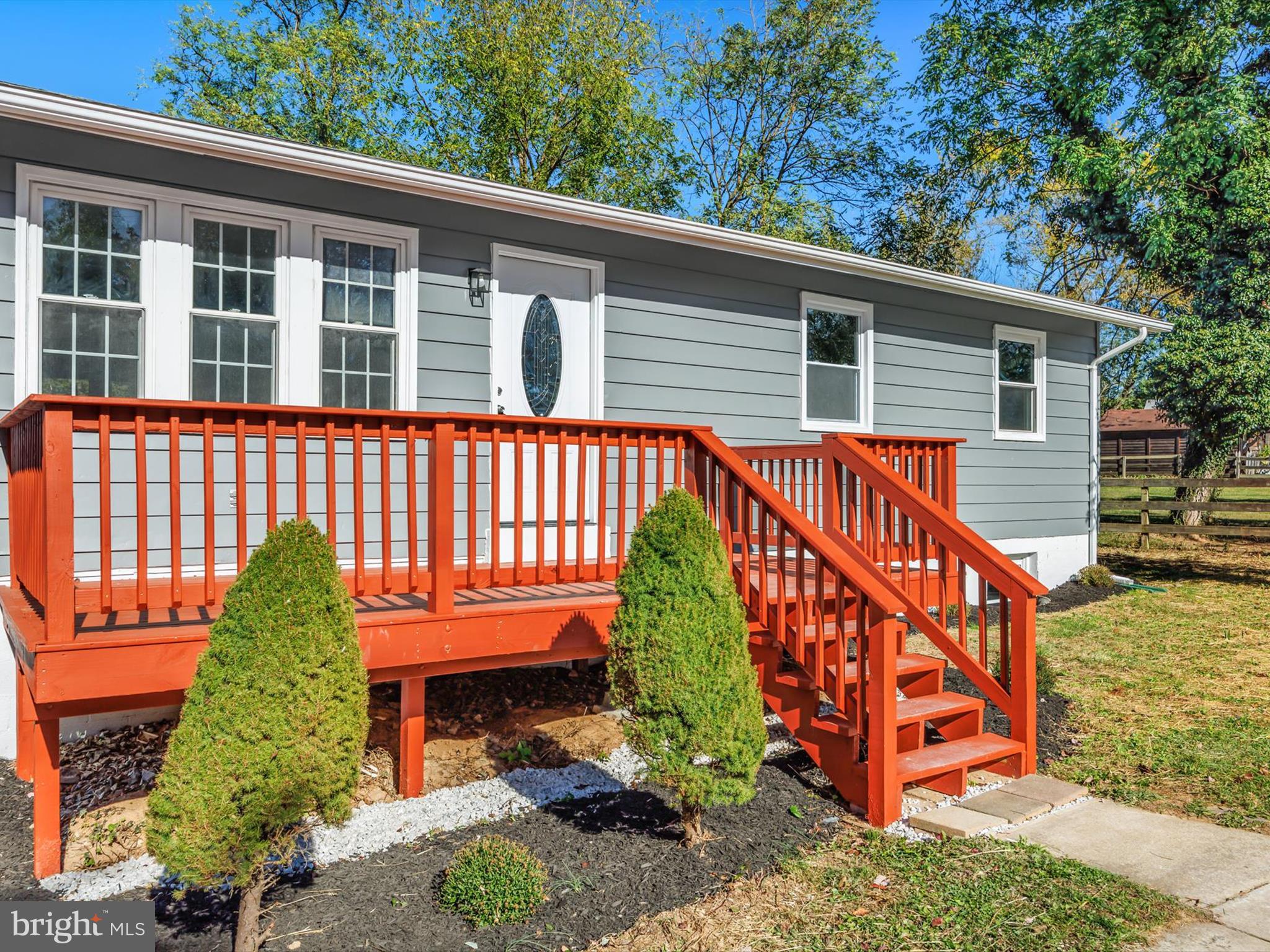 8635 Emory Grove Road Gaithersburg, MD 20877 - Photo 33 of 38 a view of a house with a yard and a wooden deck
