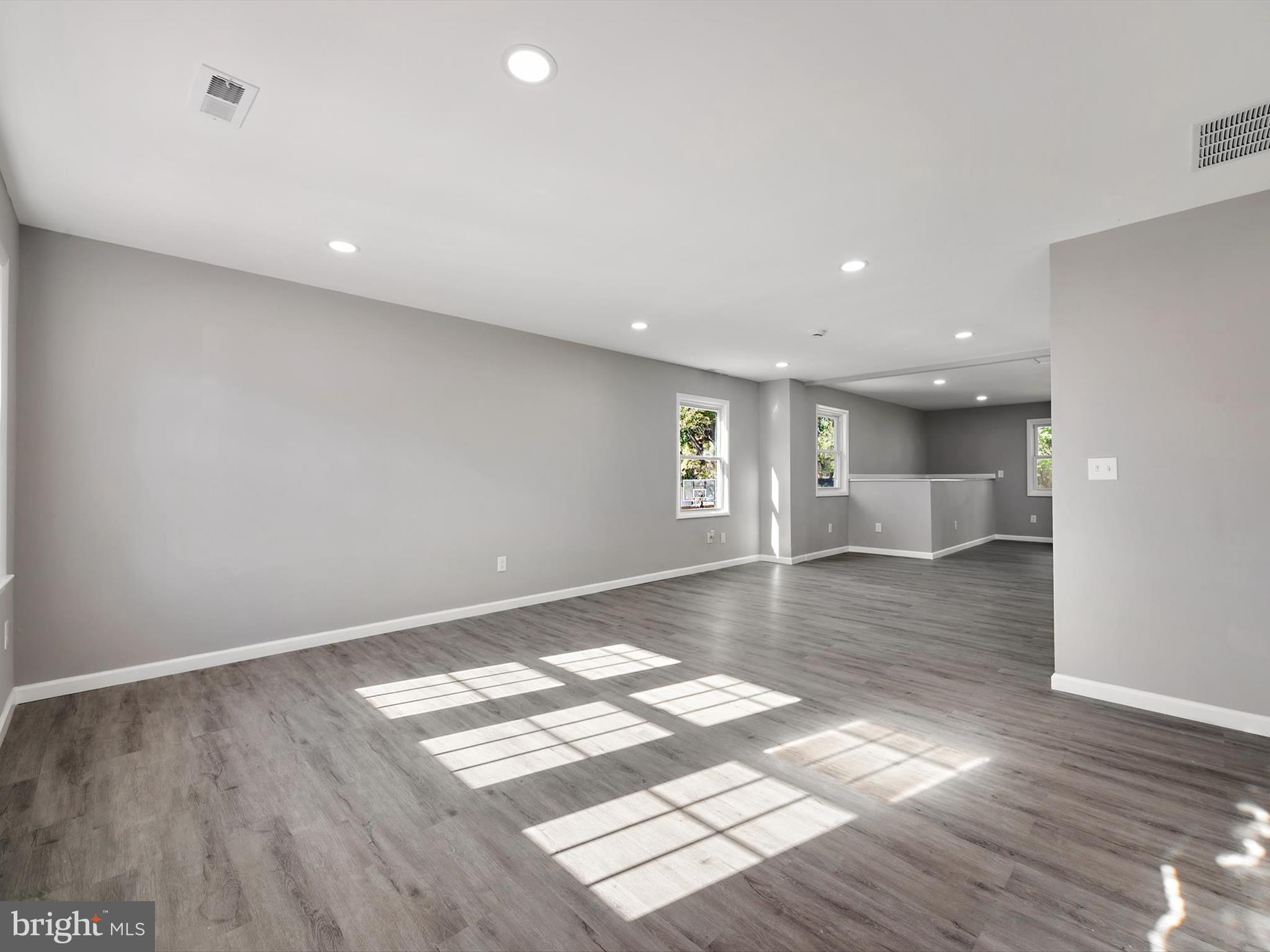 8635 Emory Grove Road Gaithersburg, MD 20877 - Photo 6 of 38 a view of wooden floor and windows in a room