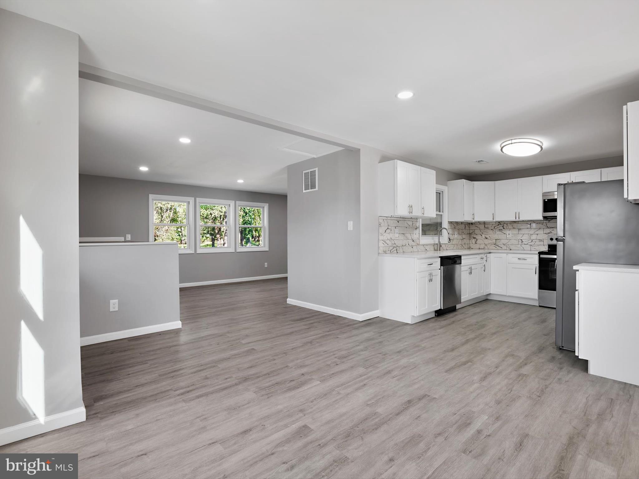 8635 Emory Grove Road Gaithersburg, MD 20877 - Photo 9 of 38 a view of kitchen with wooden floor