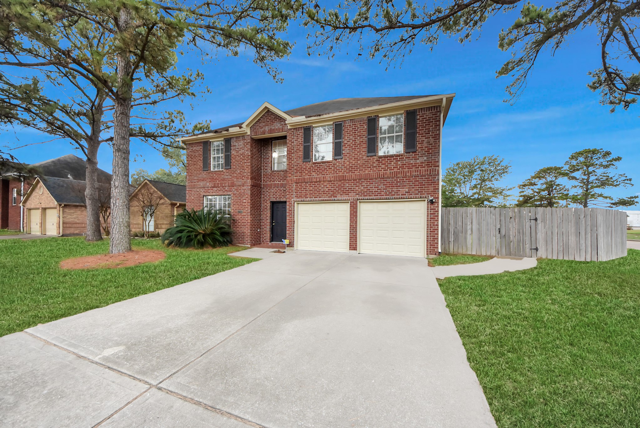 1702 Park Ridge Drive Katy, TX 77450 - Photo 1 of 30 a front view of a house with a yard and garage