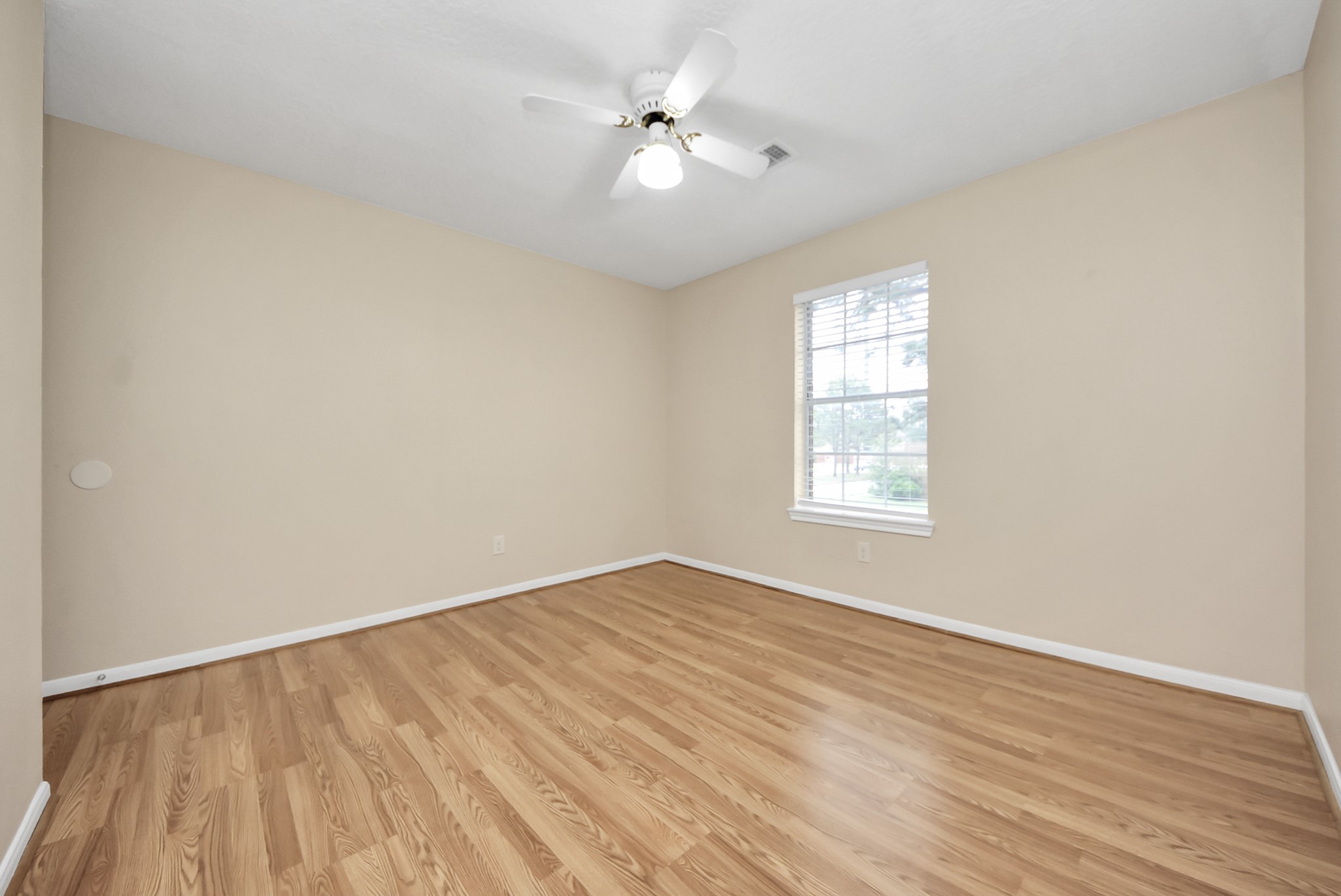 1702 Park Ridge Drive Katy, TX 77450 - Photo 16 of 30 wooden floor in an empty room with a window