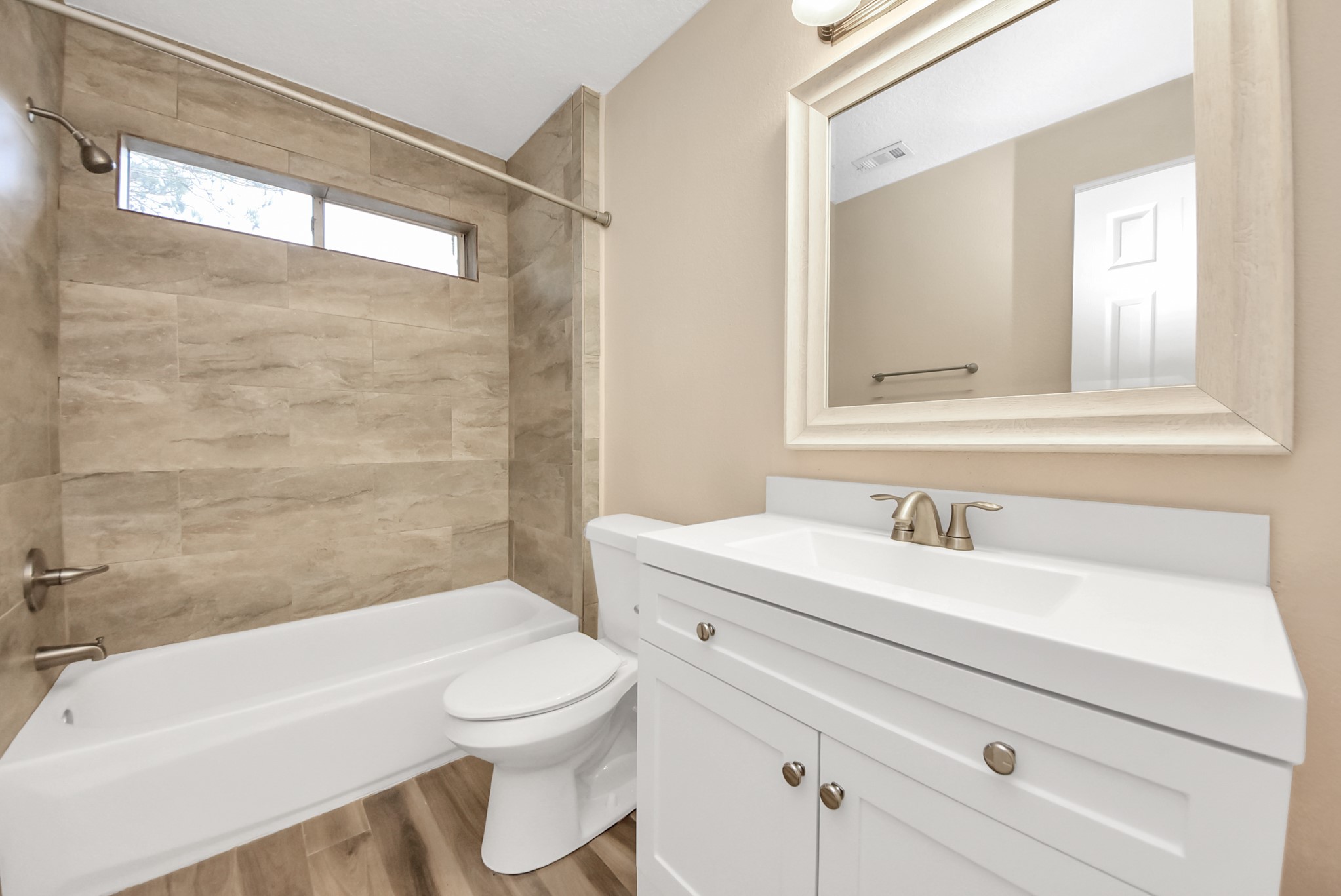 1702 Park Ridge Drive Katy, TX 77450 - Photo 17 of 30 a bathroom with a sink a toilet and a bathtub