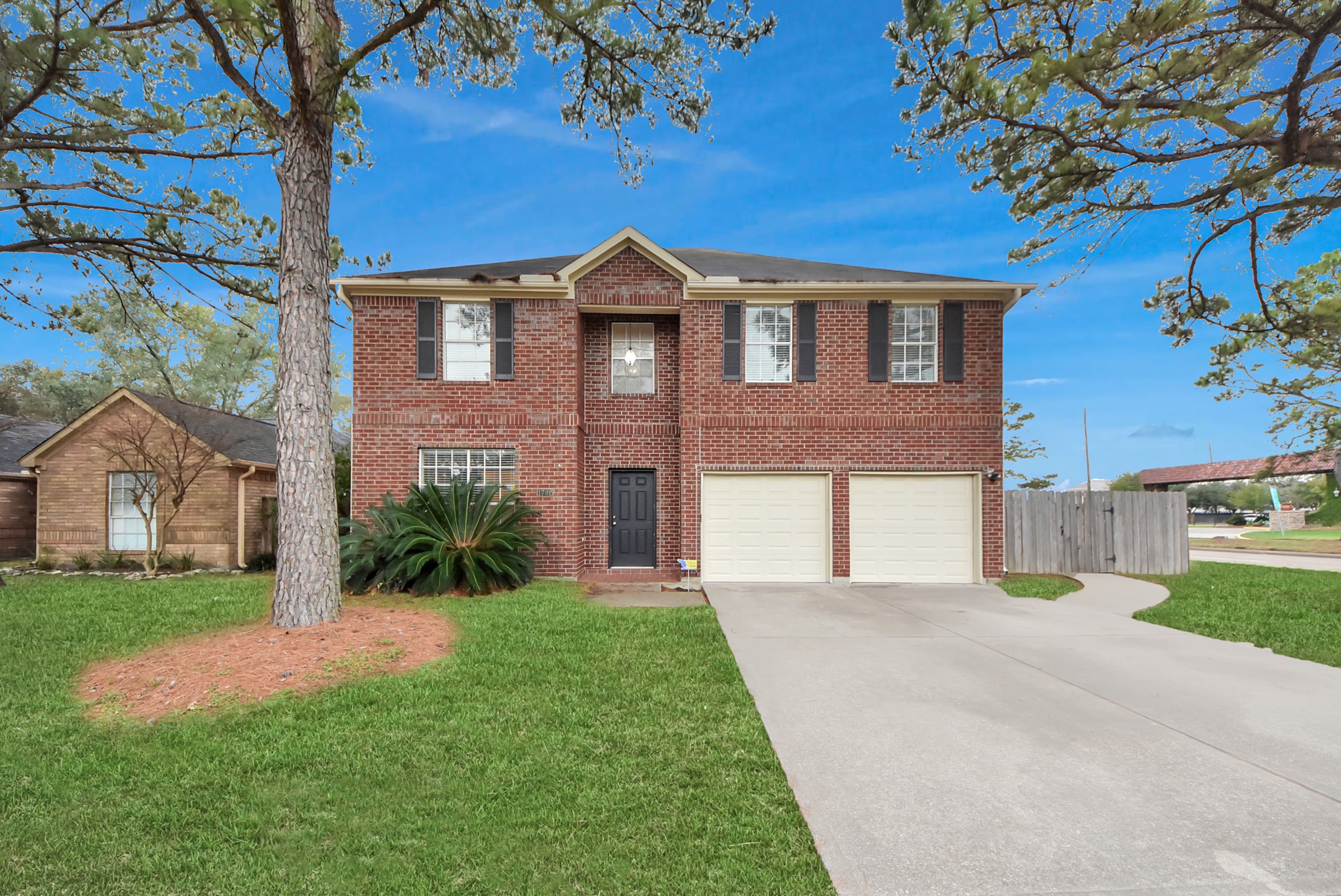 1702 Park Ridge Drive Katy, TX 77450 - Photo 2 of 30 a front view of a house with a yard and garage