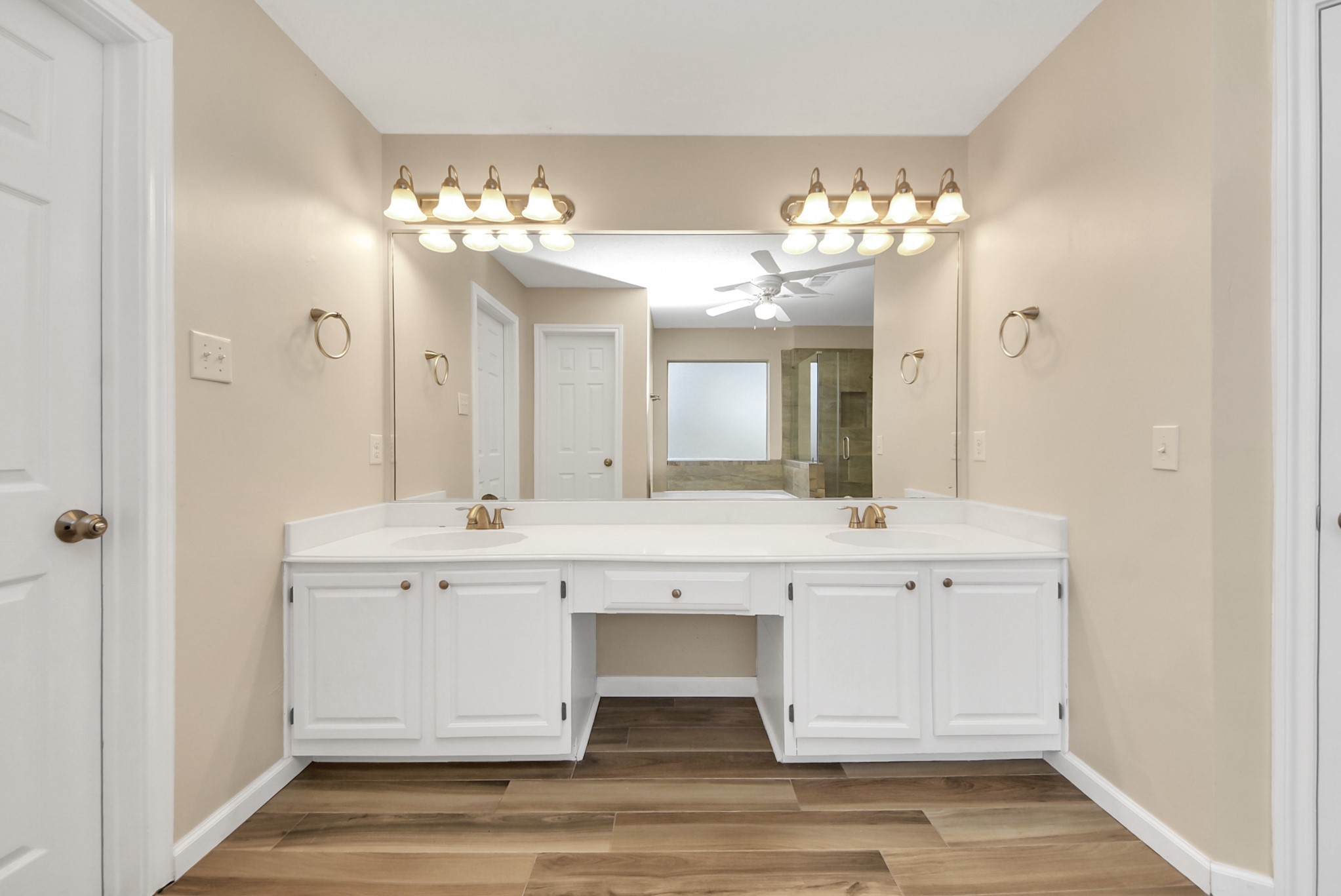 1702 Park Ridge Drive Katy, TX 77450 - Photo 27 of 30 a view of a double sink flowers in the center of a room