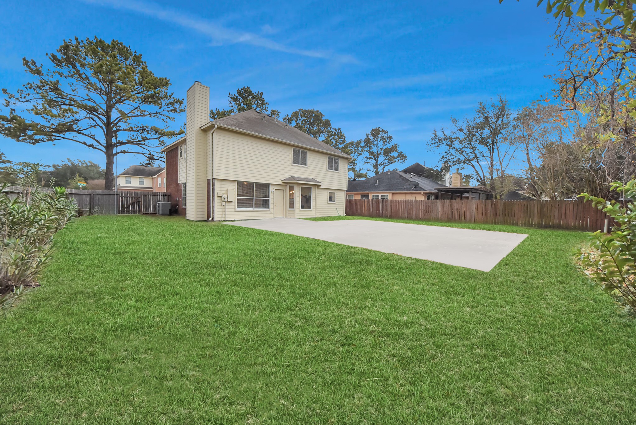 1702 Park Ridge Drive Katy, TX 77450 - Photo 28 of 30 a view of a white house with a big yard and large trees
