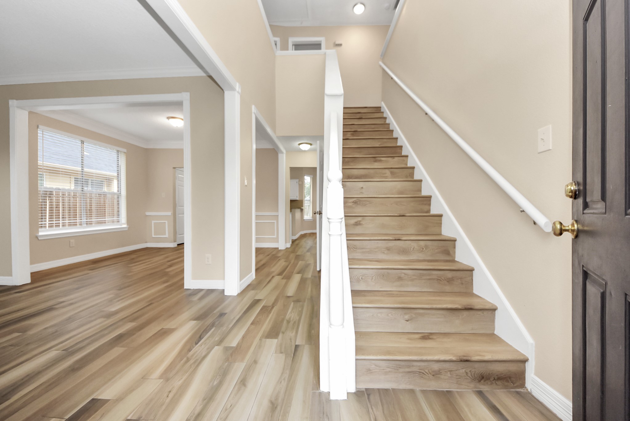 1702 Park Ridge Drive Katy, TX 77450 - Photo 30 of 30 a view of an entryway with wooden floor and stairs
