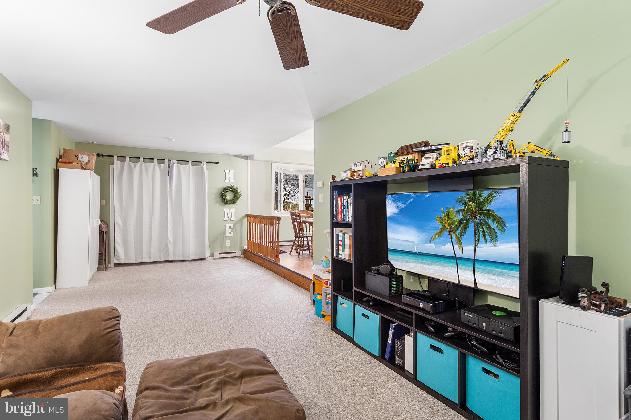 241 Diamond Street Souderton, PA 18964 - Photo 21 of 35 a living room with furniture and a flat screen tv