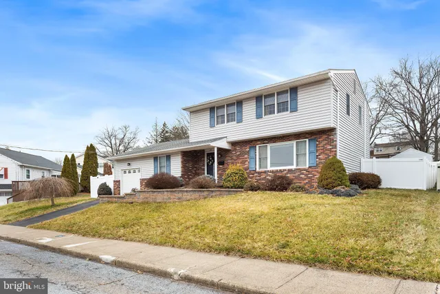 a front view of a house with swimming pool and porch