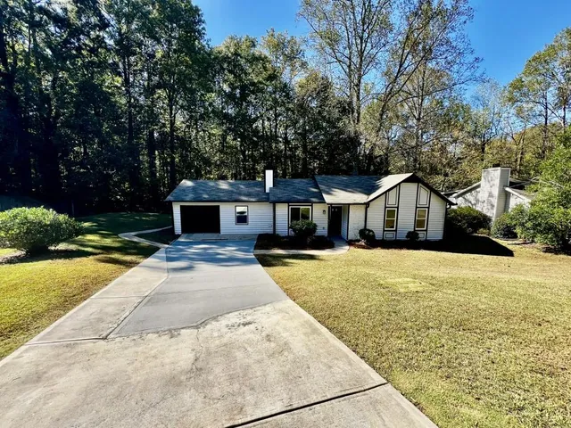 a front view of a house with yard