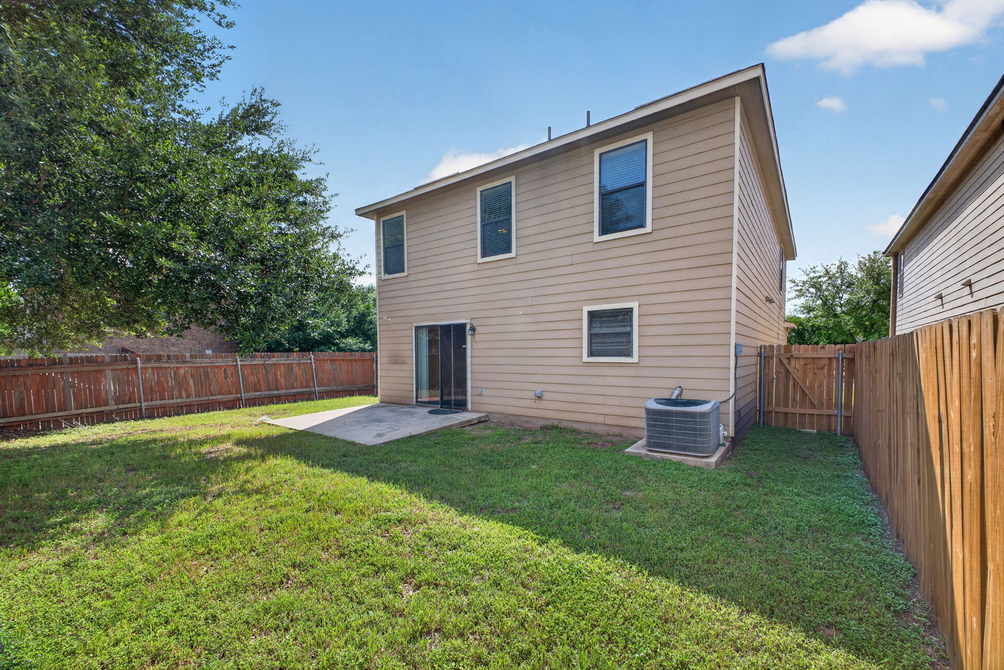8813 Wiley Way Austin, TX 78747 - Photo 32 of 39 A private yard with a concrete patio offers peaceful outdoor enjoyment.