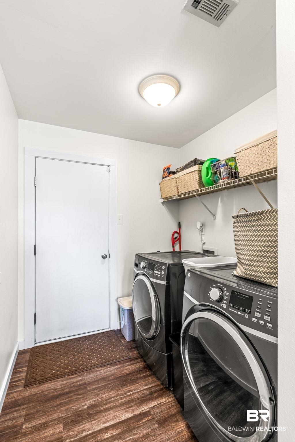 28475 Leiterman Road Elberta, AL 36530 - Photo 26 of 35 Laundry area with dark wood-style flooring, washing machine and dryer, laundry area, and visible vents