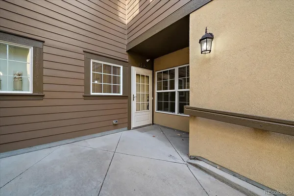 a view of front door and a window