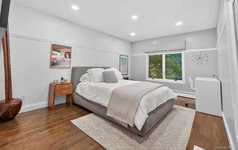 a bedroom with a bed and a couch