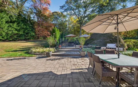 a view of yard with patio