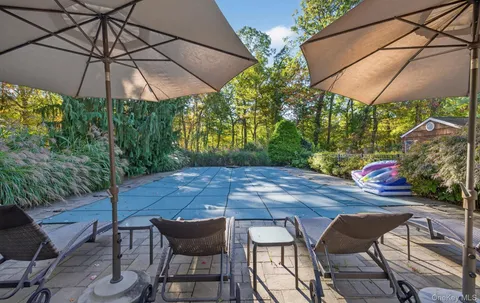 a patio with a patio table and chairs