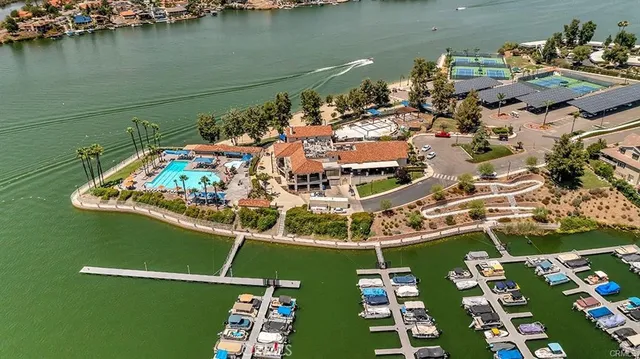 an aerial view of a house with a ocean view