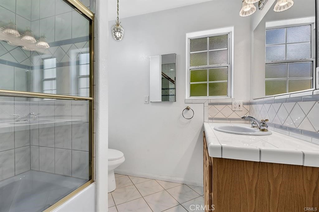 30062 Big Range Road Canyon Lake, CA 92587 - Photo 10 of 20 a bathroom with a sink a toilet and a shower