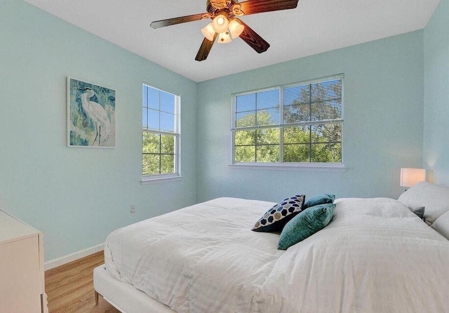 9857 Baywinds Boulevard, Unit 9302 West Palm Beach, FL 33411 - Photo 27 of 45 a bedroom with a bed and a window