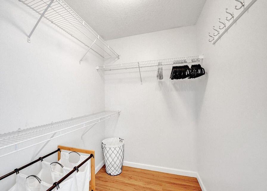 9857 Baywinds Boulevard, Unit 9302 West Palm Beach, FL 33411 - Photo 31 of 45 a view of a storage and utility room with wooden floor